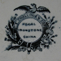 Back view of plate with printed mark "E. Challinor and Co.". This Staffordshire firm in business between 1853 and 1862.